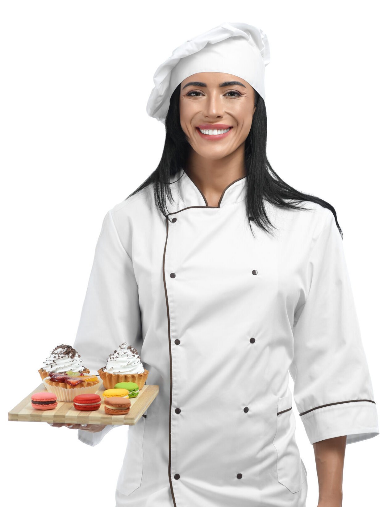 Anu in uniform holding tray with sweets.